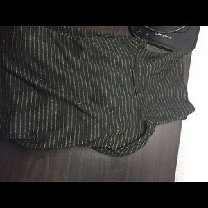 Black turtleneck with gold stripes